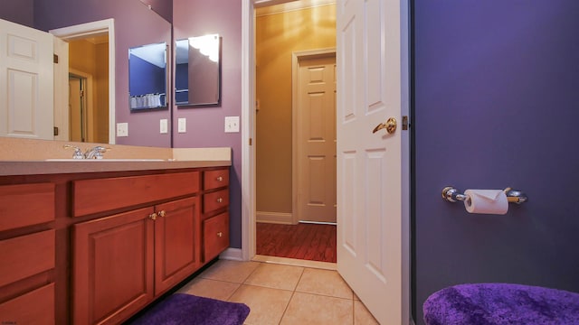 bathroom featuring tile patterned flooring and vanity