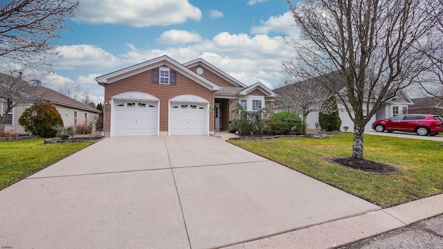 view of front of property featuring a garage and a front lawn