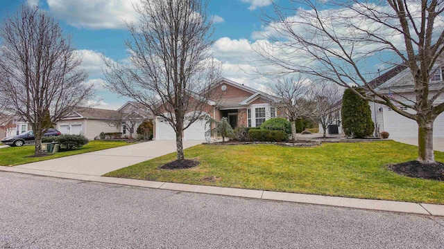 view of front of house with a front yard and a garage