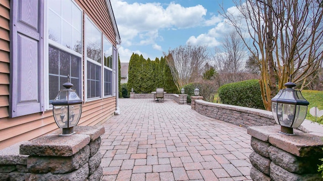 view of patio with a sunroom