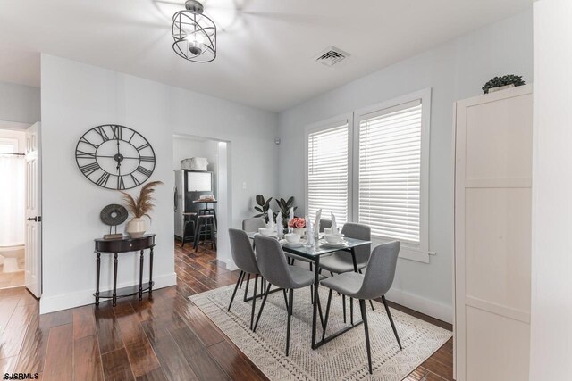 dining room featuring dark hardwood / wood-style flooring