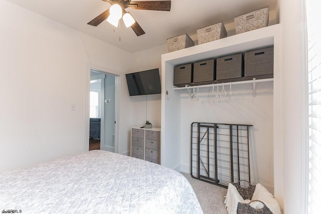 carpeted bedroom with ceiling fan