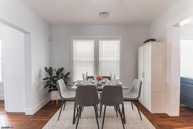 dining room with dark hardwood / wood-style floors