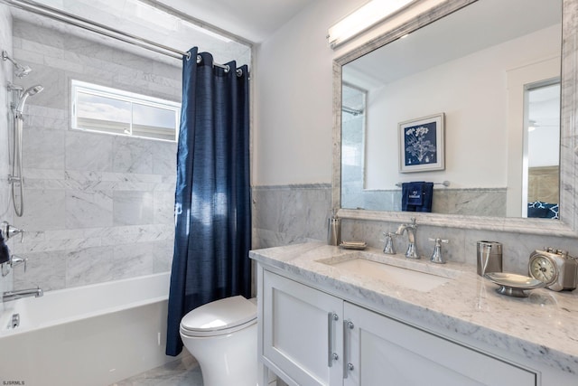 full bathroom with shower / bath combo, toilet, tile walls, and vanity