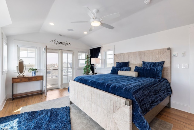 bedroom featuring hardwood / wood-style flooring, ceiling fan, and lofted ceiling