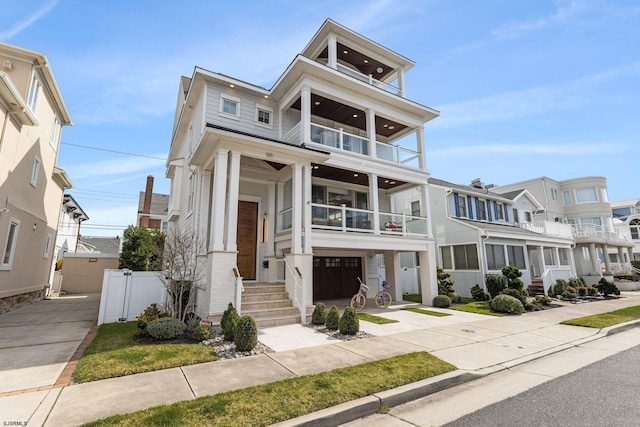 view of front of house featuring a balcony