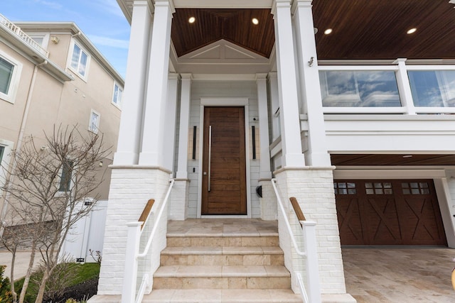 view of exterior entry featuring a garage