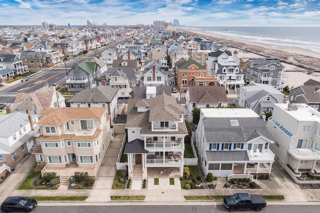 bird's eye view with a water view and a view of the beach