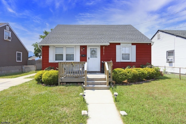 bungalow-style house featuring a front yard