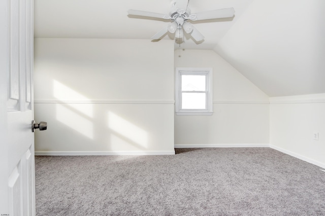 additional living space featuring ceiling fan, carpet floors, and vaulted ceiling