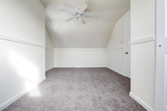 bonus room with carpet floors, vaulted ceiling, and ceiling fan