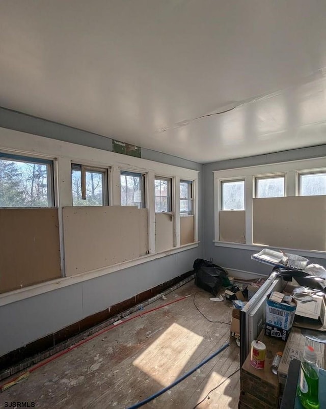 unfurnished sunroom featuring a healthy amount of sunlight