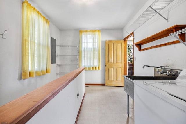 interior space with electric panel and washer / clothes dryer