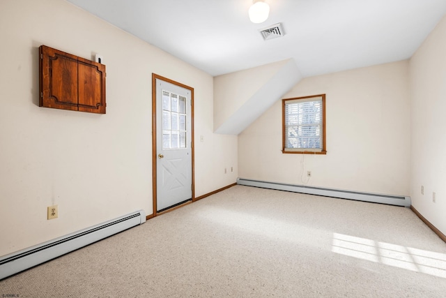 bonus room with plenty of natural light and a baseboard radiator