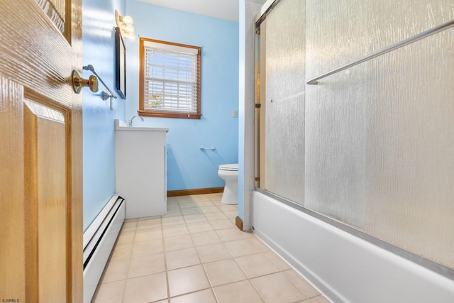 full bathroom featuring baseboard heating, tile patterned floors, vanity, and bath / shower combo with glass door