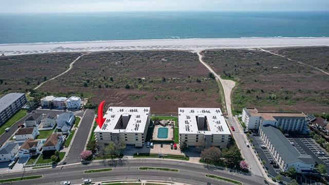 aerial view featuring a water view and a beach view