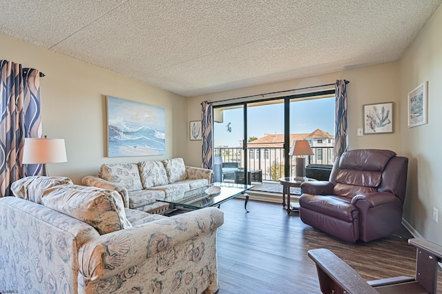 4540 W Brigantine Ave Unit N201, Brigantine, NJ 08203 - living area featuring wood finished floors and a textured ceiling