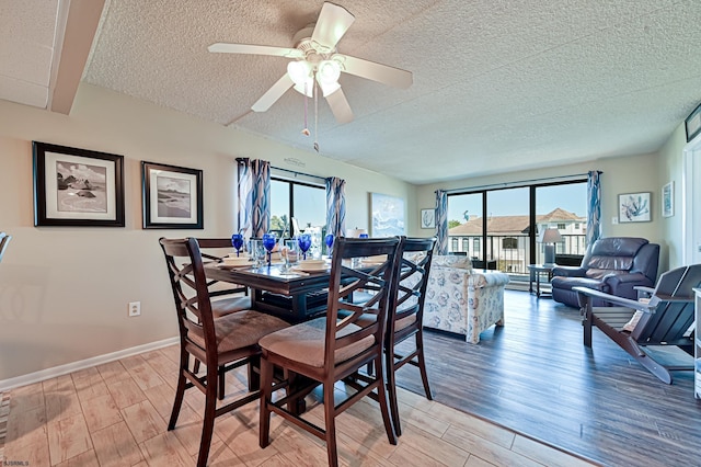 4540 W Brigantine Ave Unit N201, Brigantine, NJ 08203 - dining space with light wood finished floors, a textured ceiling, a ceiling fan, and baseboards