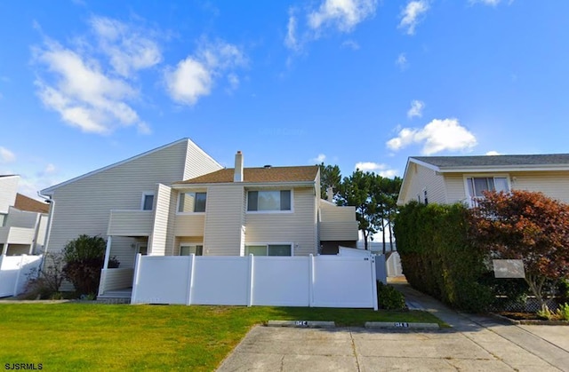 view of home's exterior featuring a yard