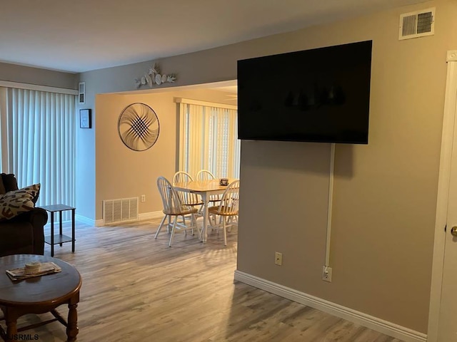 dining area featuring hardwood / wood-style floors