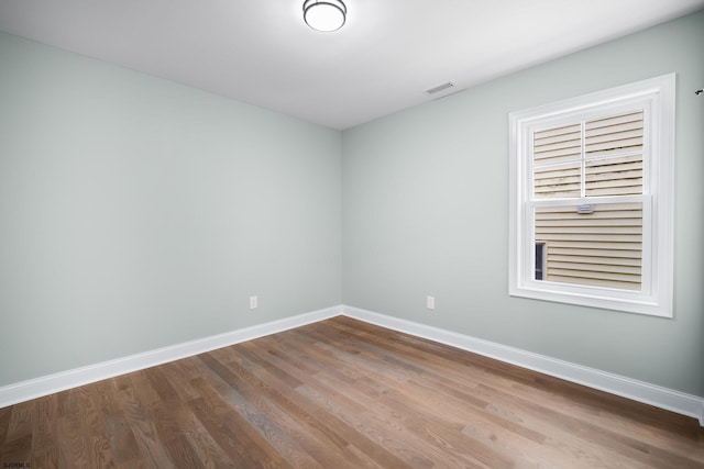 empty room featuring wood-type flooring