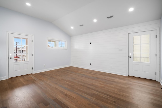 entrance foyer featuring lofted ceiling and dark wood-type flooring