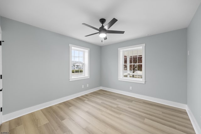 unfurnished room featuring ceiling fan, plenty of natural light, and light hardwood / wood-style flooring