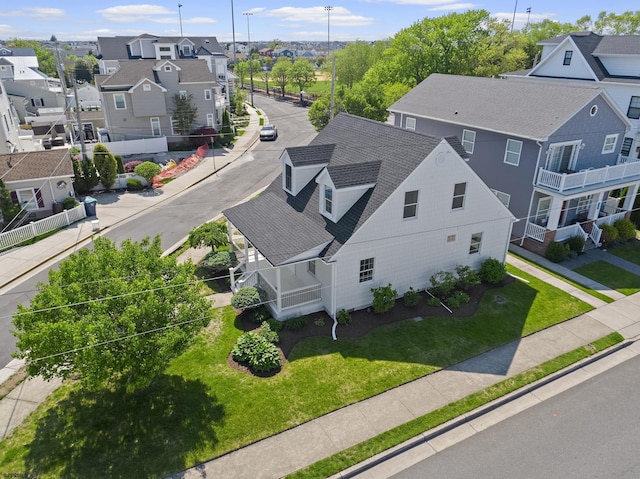 300 N Huntington, Margate, NJ 08402 - view of front of home with covered porch, a shingled roof, and a front lawn