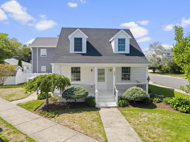 300 N Huntington, Margate, NJ 08402 - view of front of home with a porch and roof with shingles