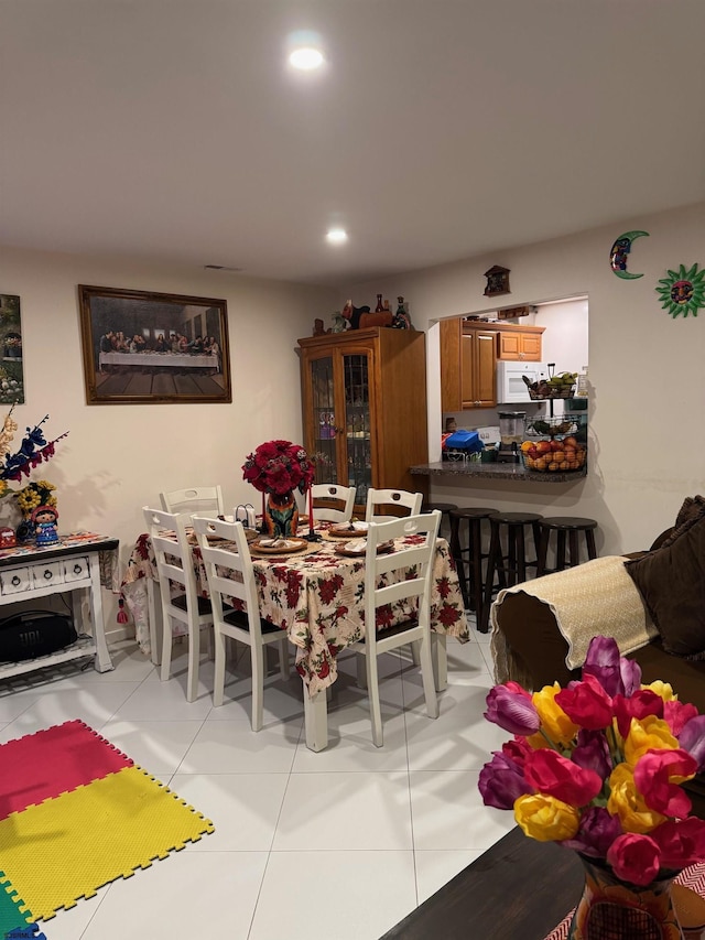 dining room featuring light tile patterned floors