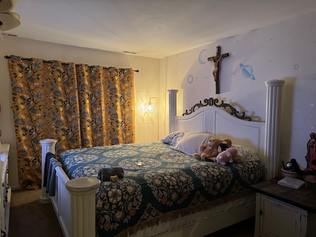 bedroom featuring dark carpet