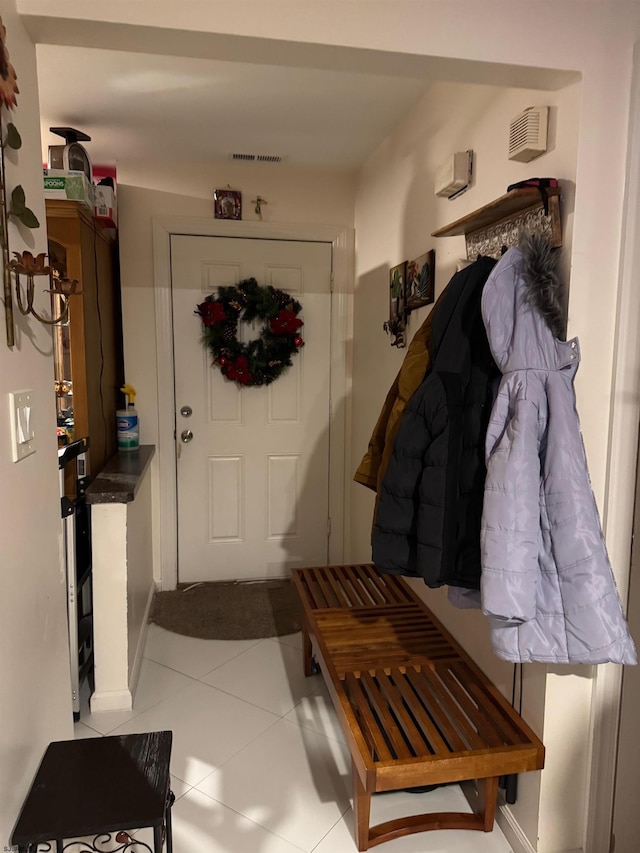 mudroom with light tile patterned floors