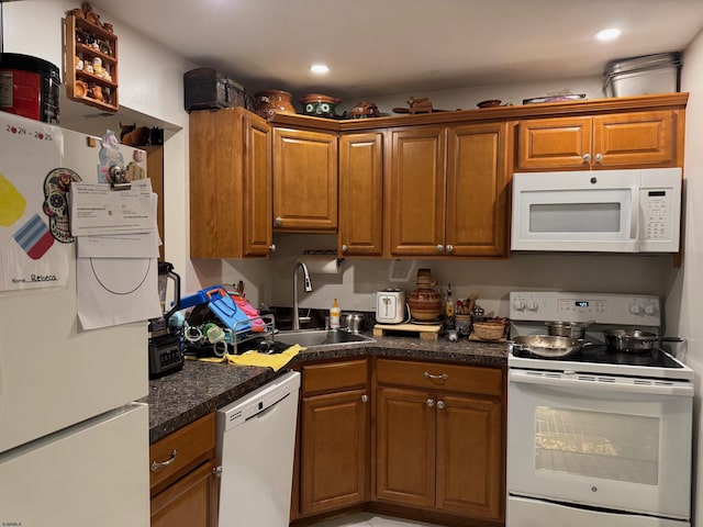 kitchen featuring sink and white appliances