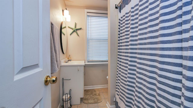 bathroom featuring vanity, tile patterned floors, and walk in shower