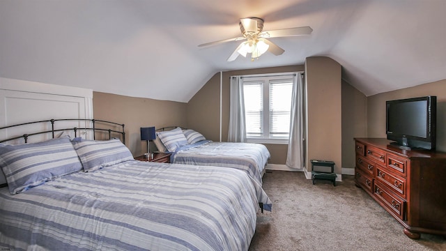 bedroom featuring ceiling fan, light colored carpet, and lofted ceiling