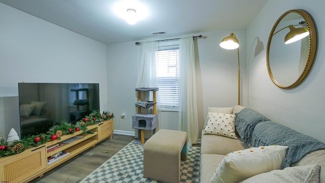 living room with dark hardwood / wood-style floors