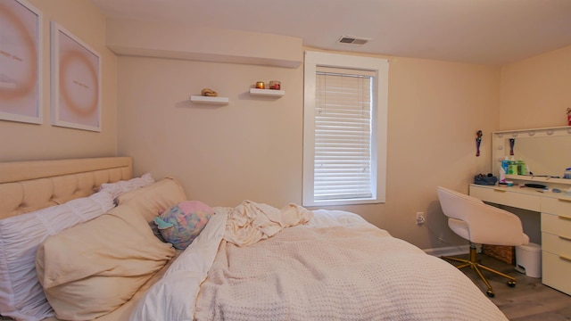 bedroom featuring hardwood / wood-style flooring