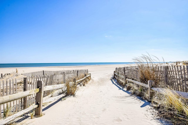 property view of water featuring a beach view