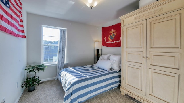 bedroom with dark carpet