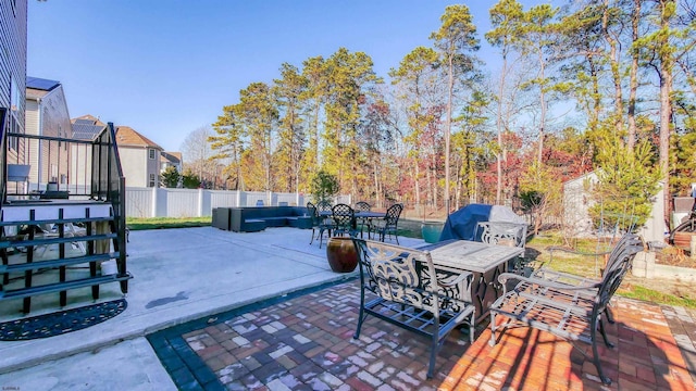 view of patio featuring outdoor lounge area and a grill