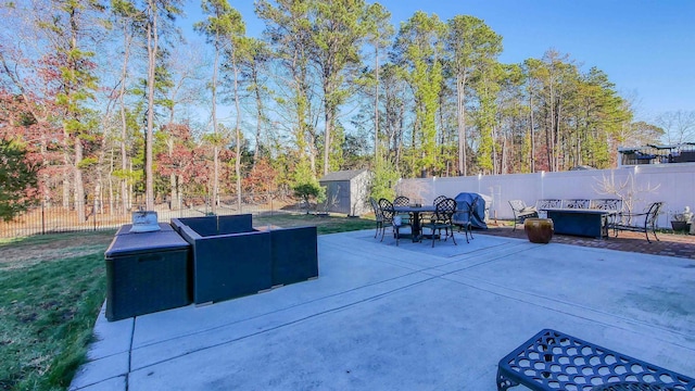 view of patio / terrace featuring an outdoor living space and a shed