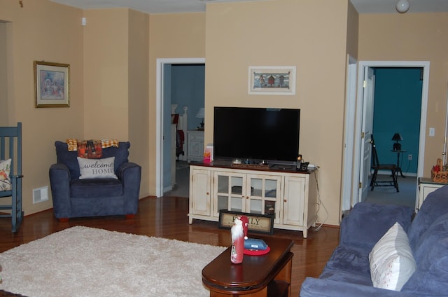 living room with dark hardwood / wood-style flooring