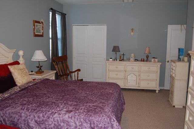 carpeted bedroom with a closet