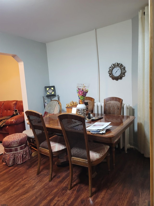 dining area with dark wood-type flooring