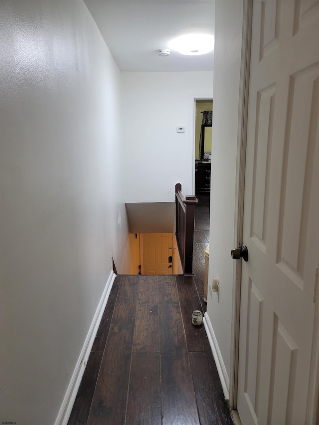 corridor featuring wood-type flooring