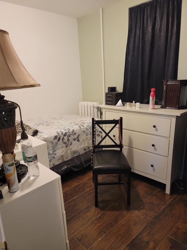 bedroom featuring radiator and dark wood-type flooring