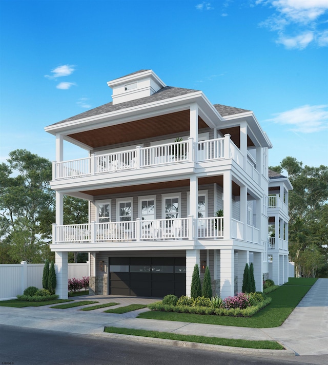 view of front of property with a garage and a balcony