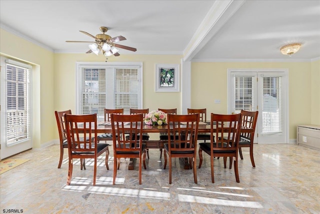 dining space featuring crown molding and ceiling fan