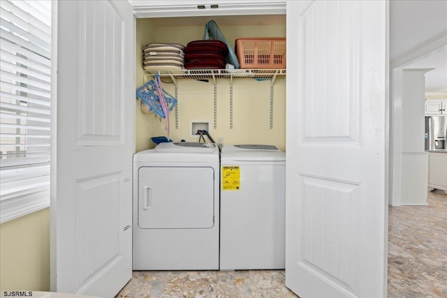 laundry room featuring separate washer and dryer