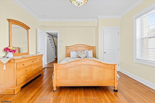 bedroom featuring hardwood / wood-style flooring and ornamental molding